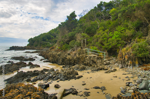 Coastal scenery with beach, rocks, forest and trail along the Cape Conran Nature Trail along the coast of Cape Conran, Gippsland, Victoria, Australia
