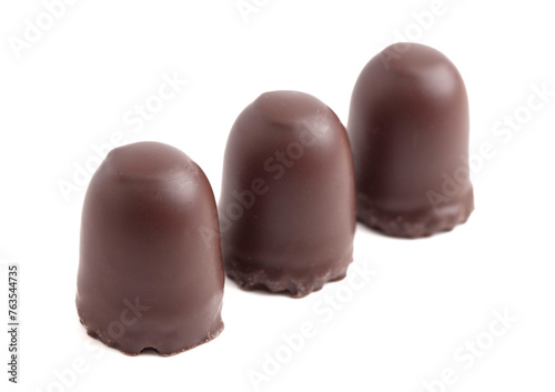 Dark Chocolate Covered Marhsmallows with a Waffer Base Known as Chocolate Kisses or Schokokuss Isolated on a White Background photo