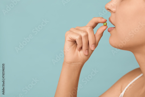 Pretty young woman taking v...