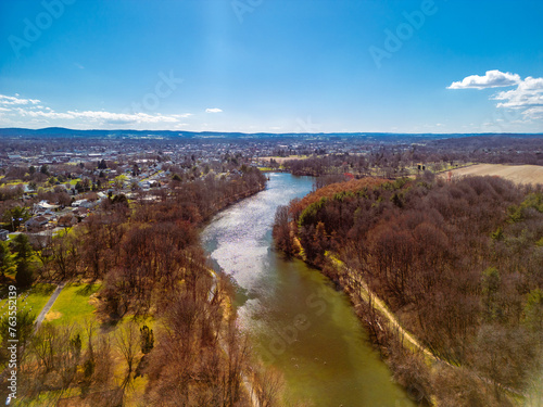 Aerial drone view of river and bright blue sky. Drone photography.