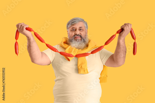 Mature man with tasty sausa...