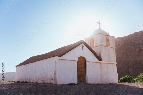 Back lit shot of San Isidro church in San Pedro de Atacama, Chile photo