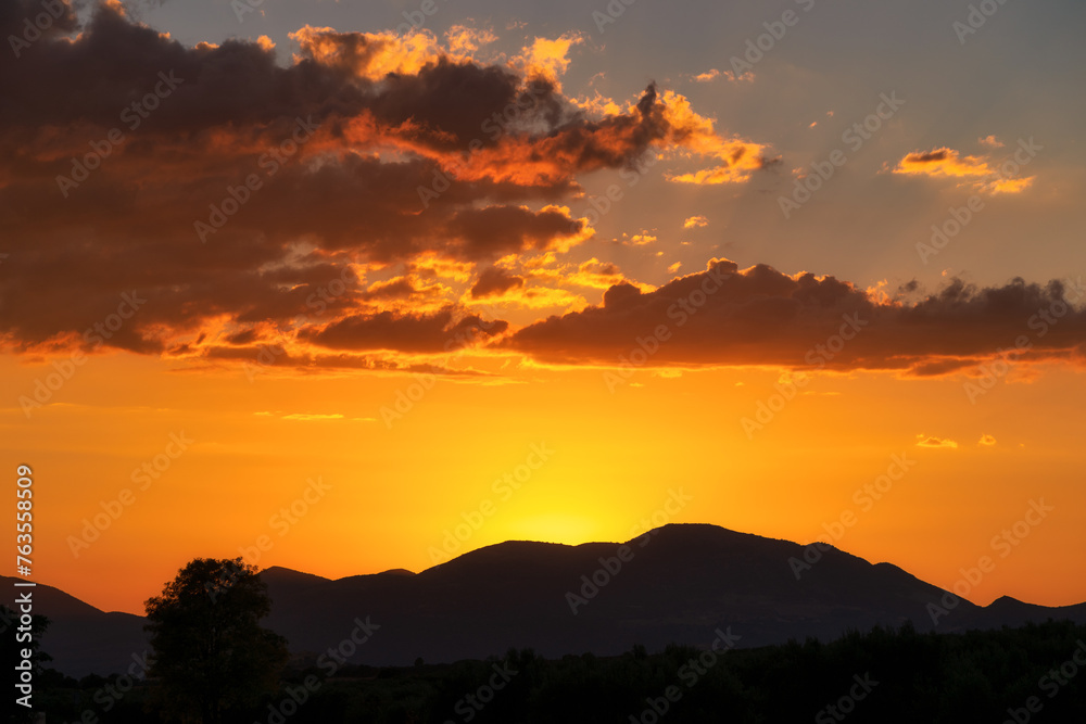 Sunset Silhouetting Mountains and Clouds Sunset Silhouetting Mountains and Clouds