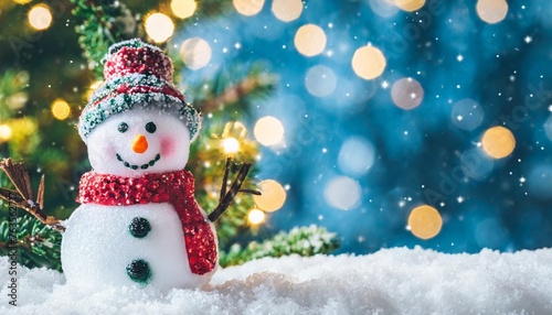 christmas winter background with snowman in snow and blurred bokeh background merry christmas and happy new year greeting card with copy space © Mac