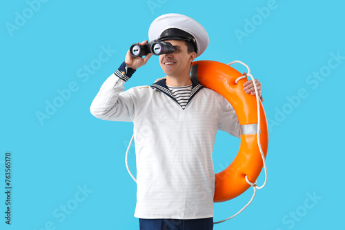 Young sailor with ring buoy...