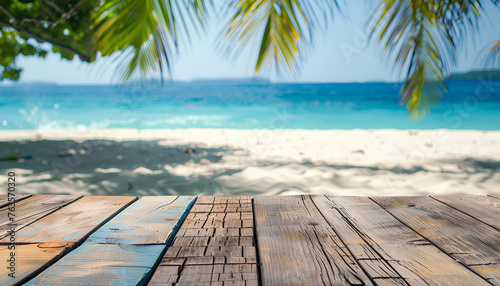 Wood table top on blurred blue sea and white sand beach background