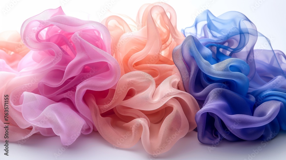 three different colored scrunffles sitting next to each other on a white surface in front of a white background. three different colored scrunffles sitting next to each other on a white surface in front of a white background.