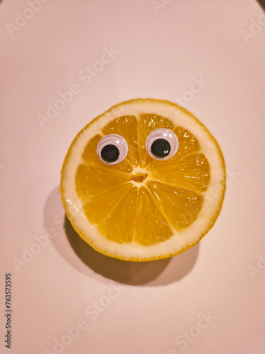 Funny lemon with cartoon eyes on isolated background 