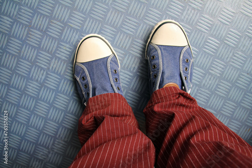 pair of shoes  and nice Trousers on the floor photo