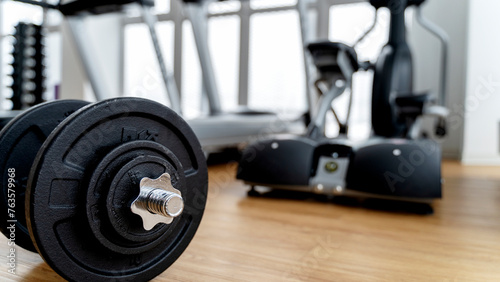 dumbbells and exercise equipment in the gym