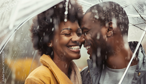 A joyful couple shares a tender moment, huddled closely under a clear umbrella amidst the rain, their laughter and affection evident in their closed eyes and broad smiles