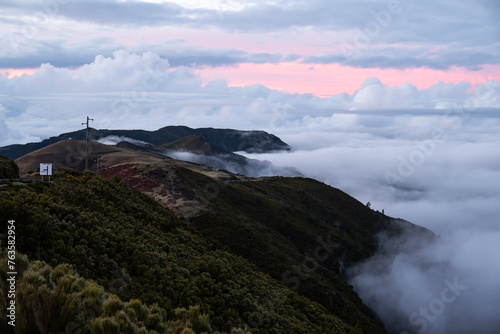 Panoramic view over the cloud-filled Ribeira da Janela valley at dusk, near Rabaçal Nature Reserve, Madeira photo