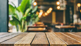 Empty wooden table in cafe setting ideal for product display featuring blurred bokeh background creating abstract for bar restaurant or coffee shop interior space for celebration business or lifestyle