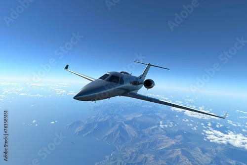 A small business jet is seen flying over a rugged mountain range, soaring through the clear blue sky. The aircraft stands out against the towering peaks as it travels through the scenic landscape