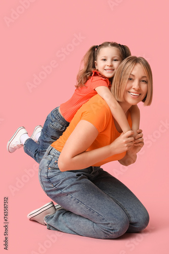 Happy mother giving her smi...