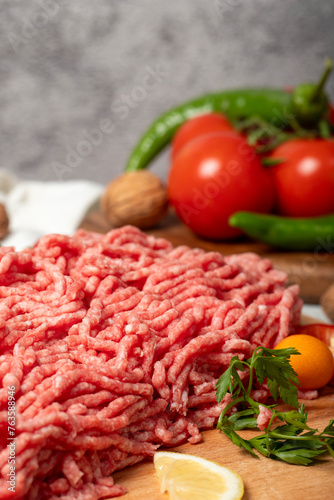 Ground beef. Raw ground beef or minced meat on wood serving board. Close up