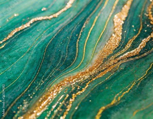Beautiful background of green marble with the addition of gold .