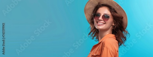 Happy woman in straw hat and sunglasses on pastel blue background. Woman isolated face portrait, banner with copy space background.