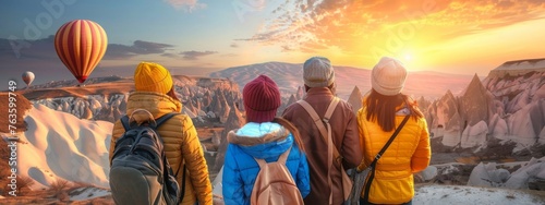 Group friends tourists in Cappadocia with backpacks watch hot air balloon with sunset, adventure Turkey Travel banner. Generation AI