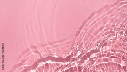 Abstract summer banner background Transparent pink clear water surface texture with ripples, splashes and bubbles. Water waves in sunlight with copy space Cosmetics moisturizer micellar toner emulsion