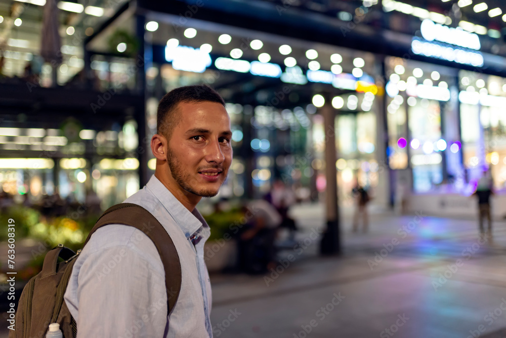 Young Handsome Man with Backpack Standing in the City Center Young Handsome Man with Backpack Standing in the City Center