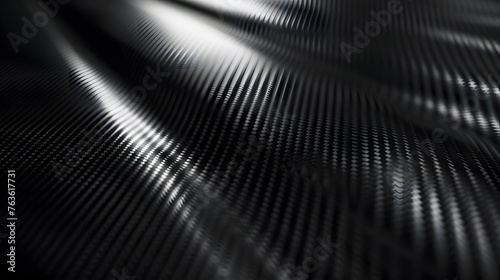 carbon kevlar fiber texture pattern backdrop, elaborate industrial carbon fiber wavy sheet structure detail in full frame view photo