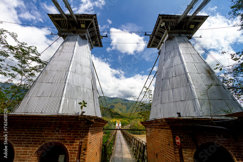 Western suspension Bridge over the Cauca River in Santa Fe de Antioquia, Colombia photo