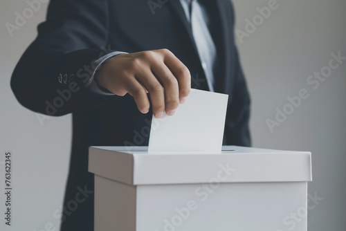 Man hand wearing black suit putting ballot into voting box. Politics, democracy, freedom, elections concept. Generative AI