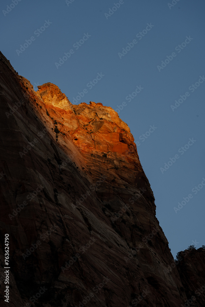 Sunlight Fades On The Peak Of The Rocks In The Canyon Of Zion