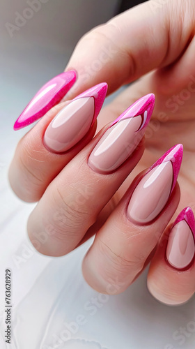 Elegant Pink and White Manicure on a Womans Hand