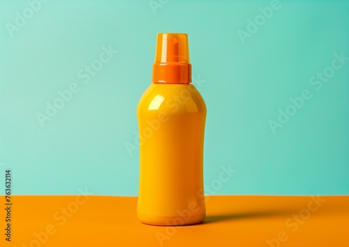 Bright Orange Sunscreen Bottle on Blue and Orange Background