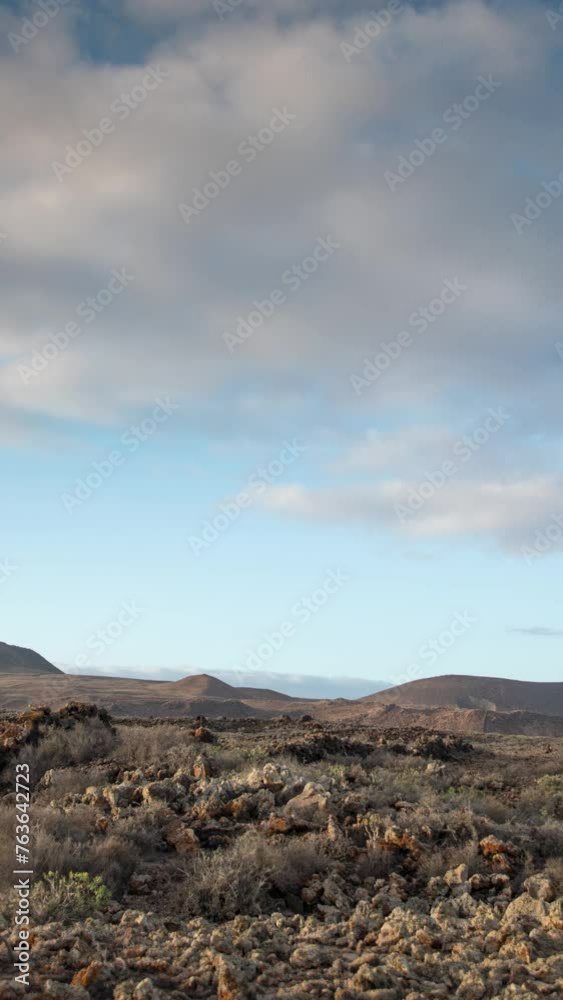 Timelapse of clouds over desert Timanfaya National Park in Lanzarote in vertical Timelapse of clouds over desert Timanfaya National Park in Lanzarote in vertical