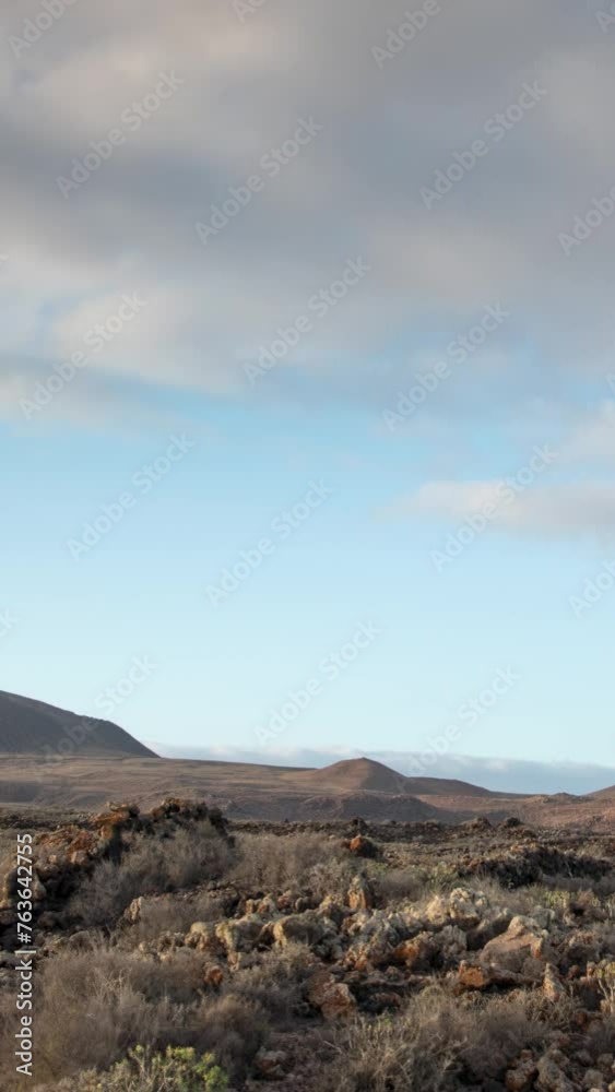 Timelapse of clouds over desert Timanfaya National Park in Lanzarote in vertical Timelapse of clouds over desert Timanfaya National Park in Lanzarote in vertical