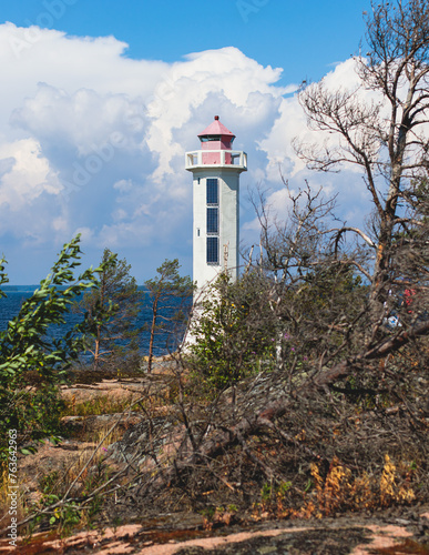 Summer aerial view of Povorotny lighthouse, Vikhrevoi island, Gulf of Finland, Vyborg bay, Leningrad oblast, Russia, sunny day with blue sky, lighthouses of Russia travel photo