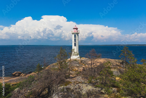 Summer aerial view of Povorotny lighthouse, Vikhrevoi island, Gulf of Finland, Vyborg bay, Leningrad oblast, Russia, sunny day with blue sky, lighthouses of Russia travel photo