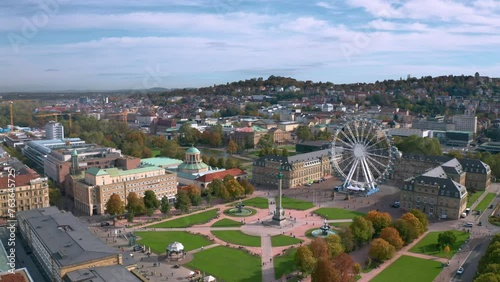 Beautiful aerial skyline cityscape of Stuttgart Mitte, Baden-württemberg, Germany at sunset. Ferris wheel and Jubiläumssäule at Schlossplatz in front of Neues schloss