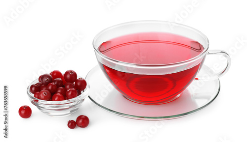 Cup of delicious cranberry tea and berries isolated on white