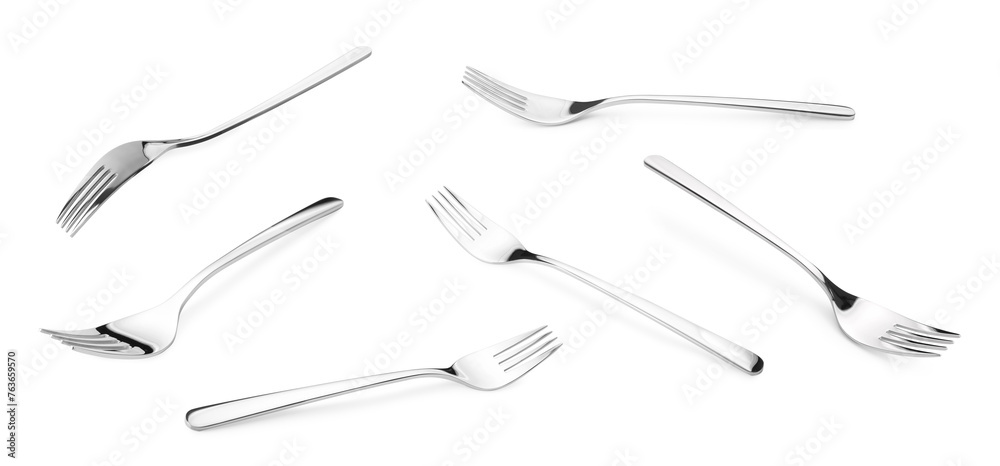 Shiny silver forks isolated on white, set Shiny silver forks isolated on white, set