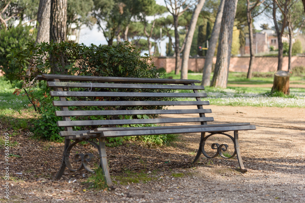 Metal bench for relaxing outdoors in a summer park