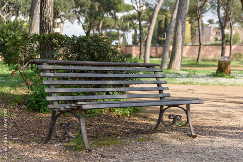 Metal bench for relaxing outdoors in a summer park