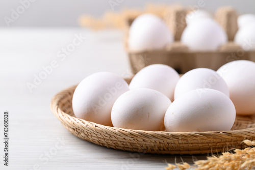Organic white leghorn egg from free range farm in natural basket