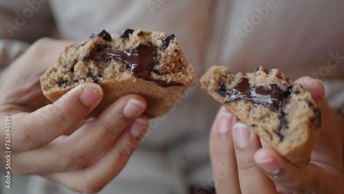  women hand breaking sweet cookies  photo