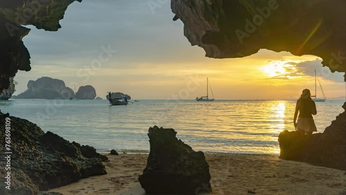 Sunset in a cave on Pranang beach. Krabi Province Thailand photo
