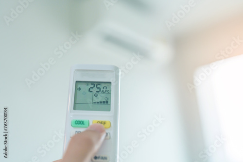 hand operating remote controller for adjust Air conditioner inside the room of office or house