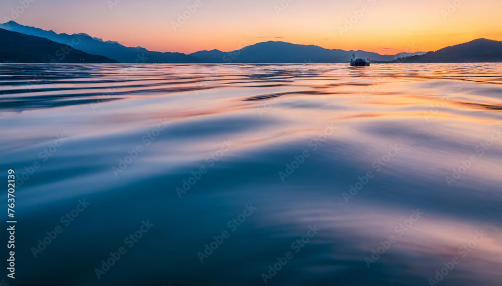 Abstract rippled water texture in sunset colors