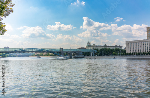 View of the Moscow river embakment, Pushkinsky bridge and cruise ships at sunset. photo