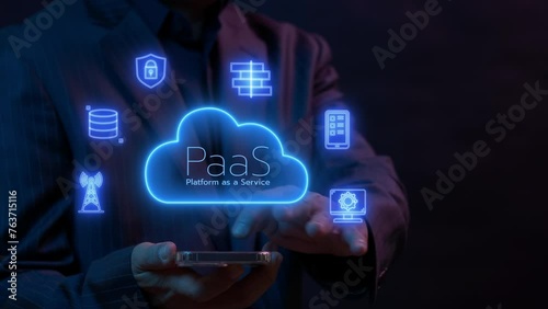 PaaS, Platform as a Service concept. Cloud computing service on software platform. Businessman working with smartphone to operate cloud PaaS icon on virtual screen. photo