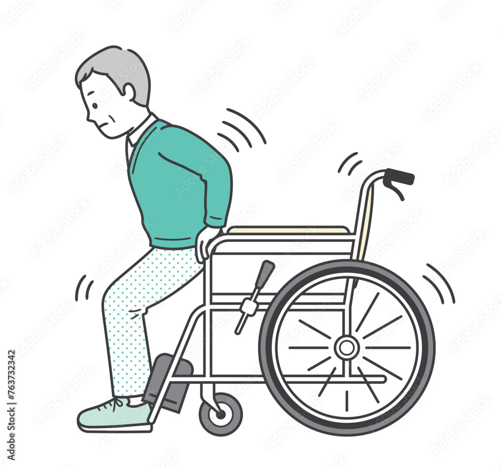 車椅子から立ち上がろうとする高齢男性