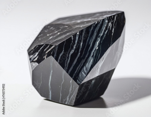 black natural gemstone rock stone of obsidian isolated in bright background