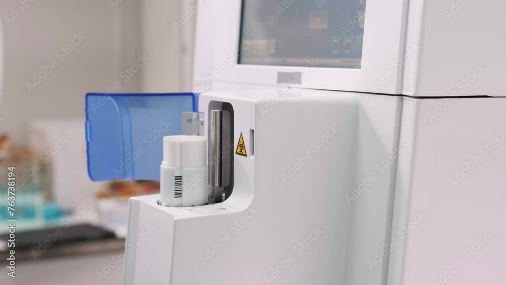 Medical research laboratory and analyzer with blood sample tubes performing tests. Pharmaceutical and biological laboratory. Medical research laboratory and analyzer with blood sample tubes performing tests. Pharmaceutical and biological laboratory.